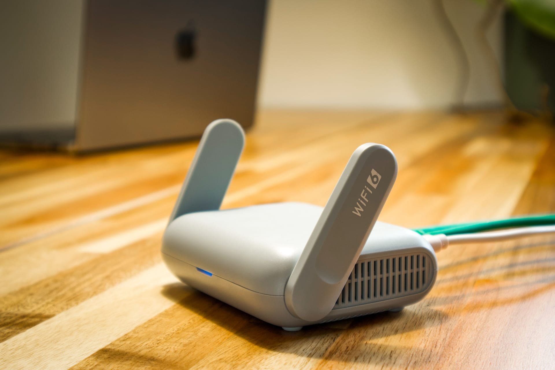 A home Wi-Fi router on a shelf